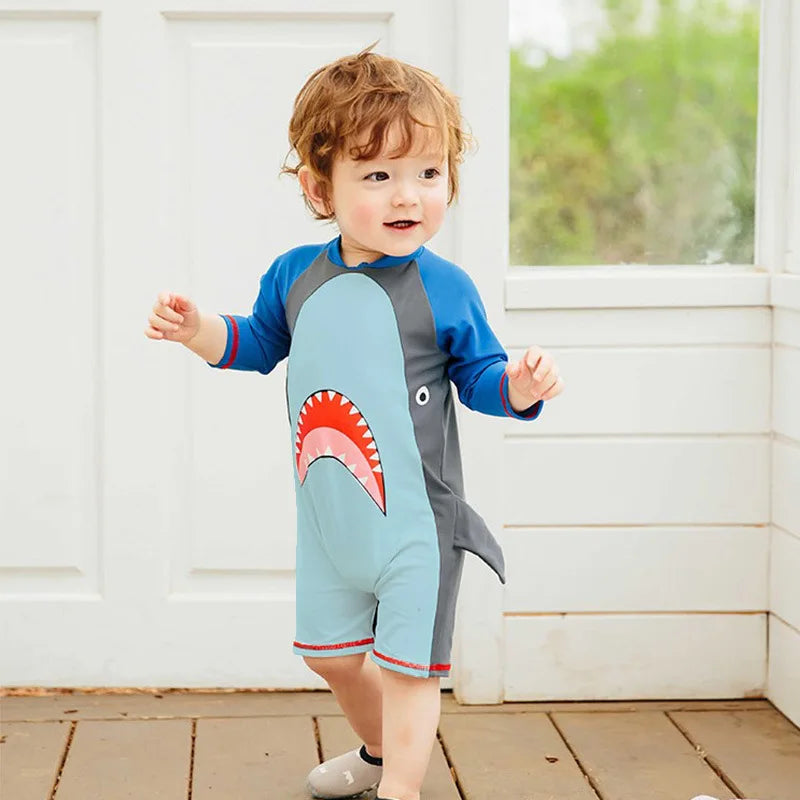Boys' one-piece swimsuit with shark print.